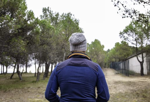 Hooded person in forest with problems, youth and crisis