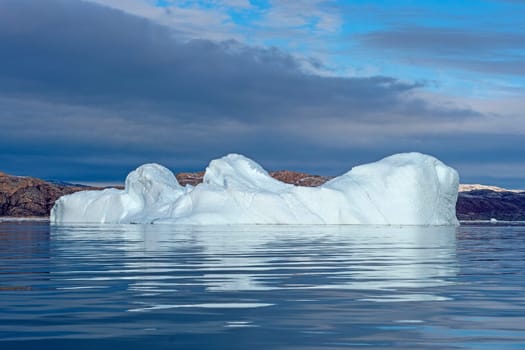 Massive Iceberg Floating in Calm Waters Near Eqip Sermia in Greenland