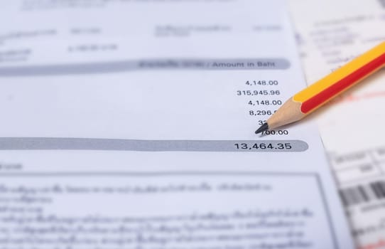 Utility energy bill with pencil blurred background, Bill and saving concept