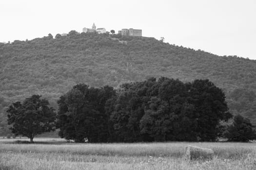 View of the hill on which stands the old castle Grobnik with the surrounding nature (Frankopanski kastel Grad Grobnik)