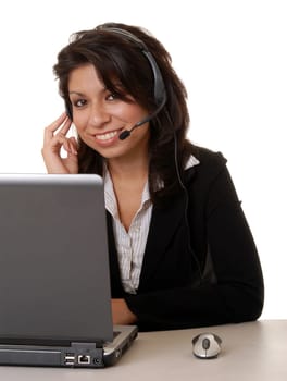 Lovely isolated latina business woman working hard wearing a headset microphone