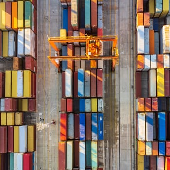 Aerial view of shipping container port terminal. Colourful pattern of containers in harbor. Maritime logistics global inport export trade transportation