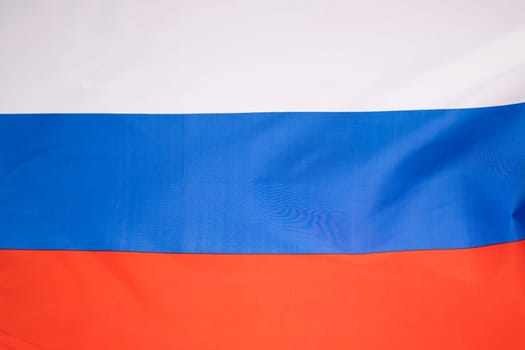 Waving colorful national flag of russia. Russian-Ukrainian conflict concept