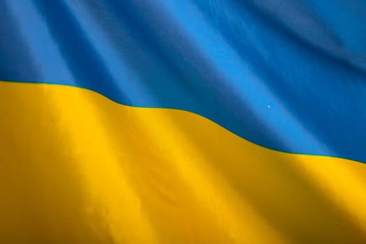 Flag of Ukraine. Blue and yellow colors. Close up shot, background