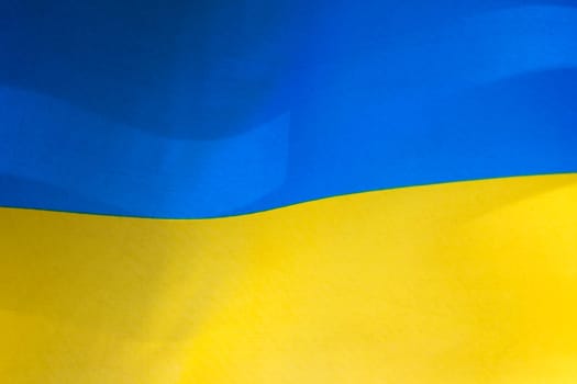 Flag of Ukraine, UA. Blue and yellow colors. Close up shot, background