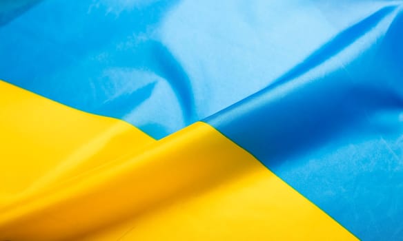 Flag of Ukraine. Blue and yellow colors. Close up shot, background