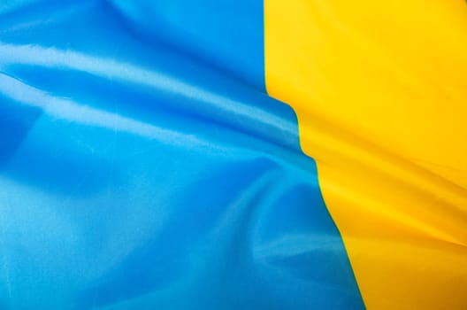 Flag of Ukraine. Blue and yellow colors. Close up shot, background
