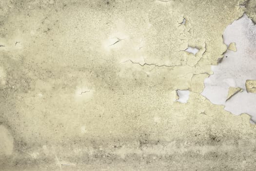 Deteriorated yellow wall with mold