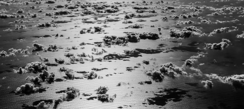 Beautiful clouds over the Atlantic ocean. Artistic black and white image
