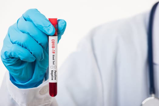 Doctor scientist in white uniform wear a mask holding test tube Coronavirus test blood sample in a clinical laboratory for analyzing isolated on white, medicine COVID-19 pandemic outbreak concept