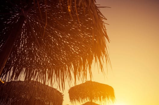 Parasols at sunset in retro style
