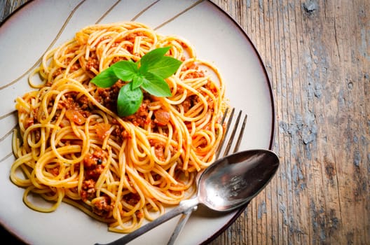 Italian spaghetti on rustic wooden table