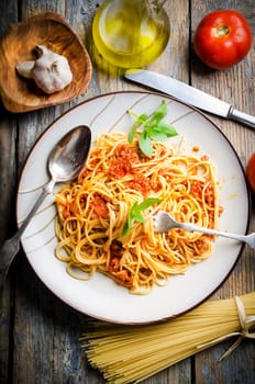 Italian spaghetti on rustic wooden table