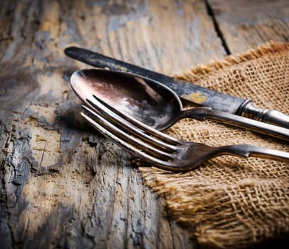 Vintage silverware on rustick wooden background