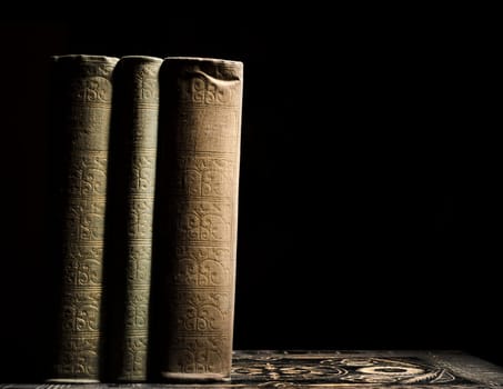 Old books in fornt of black background