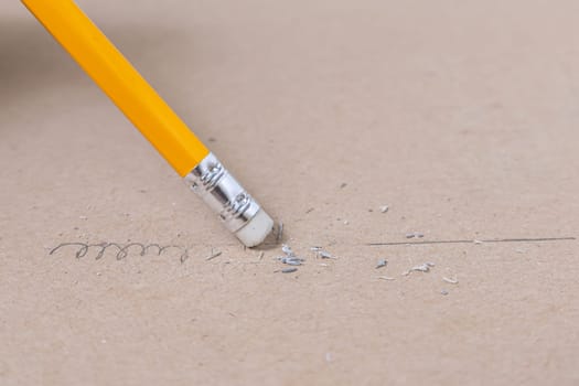 Close up a eraser pencil a straight line and crooked line, Mistake and Unsuccessful concept, Eraser pencil with brow paper