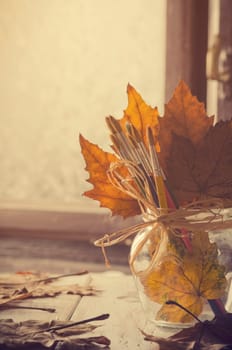 Art brushes and maple leaves. Art concept.