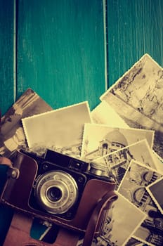 Vintage photo camera and old photos.