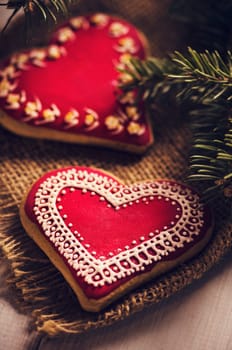 Red heart shaped cookies decorated with sugar.