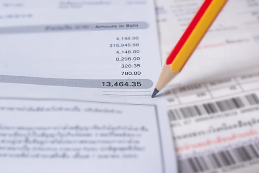 Utility energy bill with pencil blurred background, Bill and saving concept
