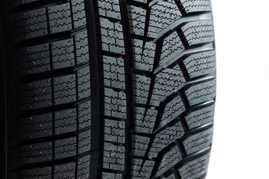 Pattern of tires in close up isolated on white background. wheel cut out. Structured rubber on automobile in detail. Textured wheels shot in studio.