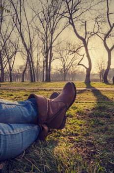 Woman in boots resting in nature