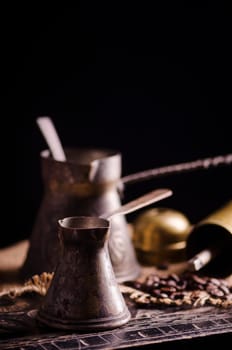 Vintage oriental coffee pot on rustic wooden table