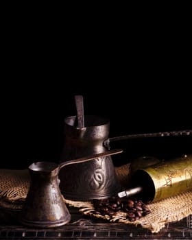 Vintage oriental coffee pot on rustic wooden table
