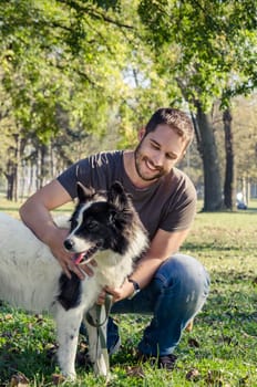 Man and his dog playing in the park