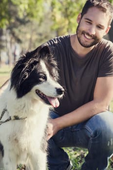 Man with his dog playing in the park