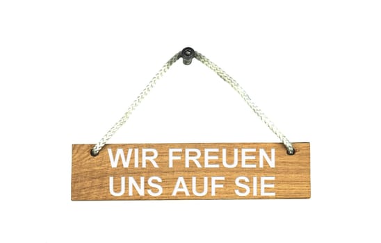 Isolated wooden board with rope: We are looking forward to see you in german language