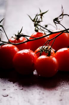 Close up of cherry tomatoes with water drops.