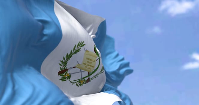 Detail of the national flag of Guatemala waving in the wind on a clear day. Guatemala is a country in Central America. Selective focus.
