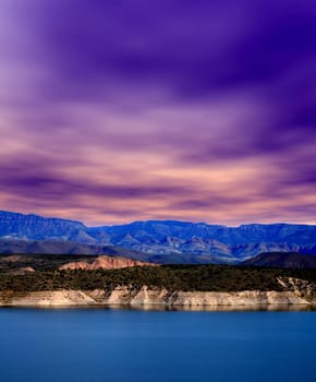 Mountain and reflections of Mountain in Roosevelt lake Central Arizona