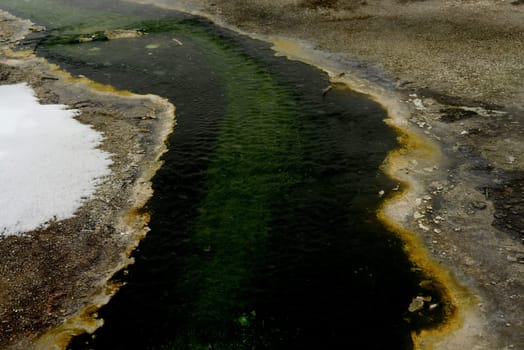 Water Runoff  from Geothermal pool in winter Yellowstone National Park