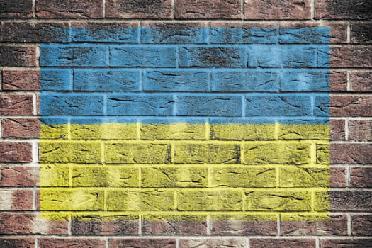 A Ukraine flag on a brick wall background