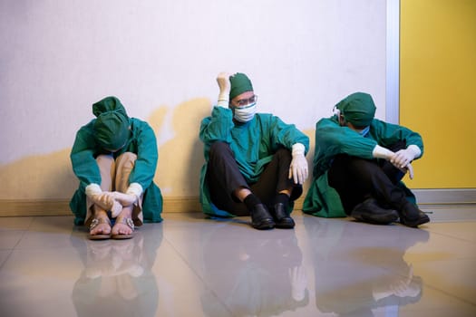 Tired doctor, Group of surgery doctors sadness fatigue after surgery, emotional sitting stress of overworked doctor and medical care team during covid-10, Surgical team tired after operation