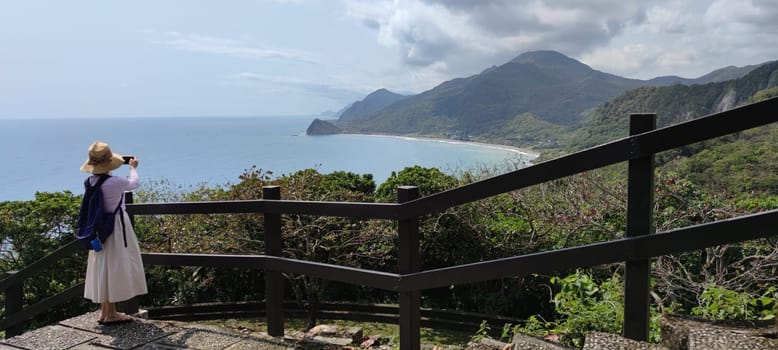 Hualien ocean of Taiwan. China. Beautiful blue sea with lush mountain and granite pebble beach