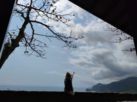 Hualien ocean of Taiwan. China. Beautiful blue sea with lush mountain and granite pebble beach