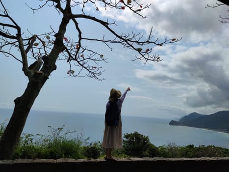 Hualien ocean of Taiwan. China. Beautiful blue sea with lush mountain and granite pebble beach