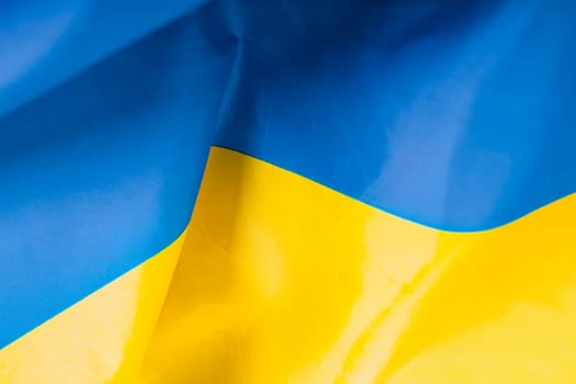 Flag of Ukraine. Blue and yellow colors. Close up shot, background