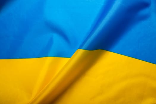 Flag of Ukraine. Blue and yellow colors. Close up shot, background