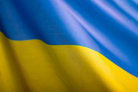 Flag of Ukraine. Blue and yellow colors. Close up shot, background