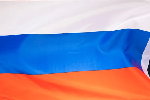 Waving colorful national flag of russia. Russian-Ukrainian conflict concept