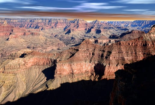 Late afternoon in the Grand Canyon Arizona with blue white and red sky