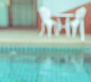 Abstract blurred image of outdoor swimming pool for background
