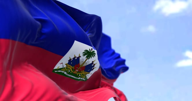 Detail of the national flag of Haiti waving in the wind on a clear day. Haiti is a country located on the island of Hispaniola in the Greater Antilles. Selective focus.