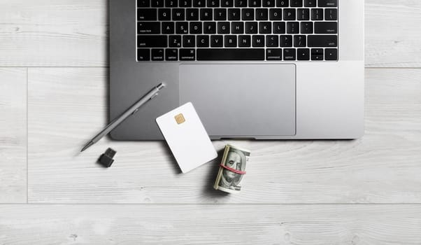 Office supplies and gadgets on wooden background. Copy space for your text. Flat lay.