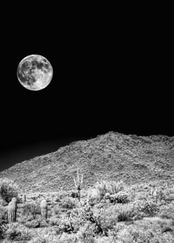 Infrared monochrome desert moon over the southwestern USA Sonora desert Arizona and mountains