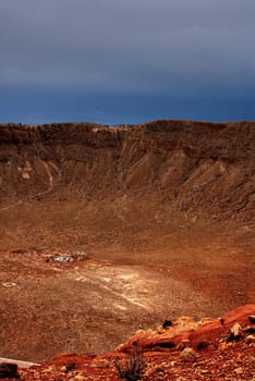 Meteor crater in Arizona with storm approaching